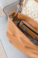 Load image into Gallery viewer, There&#39;s multiple pockets in the Kaley shoulder bag, the tan bag comes with a fun animal print lining
